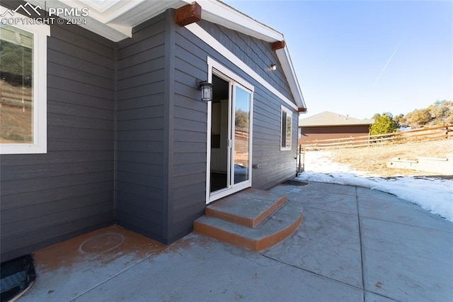 view of side of property with a patio