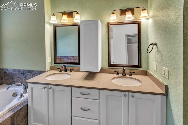 bathroom with vanity and a relaxing tiled tub