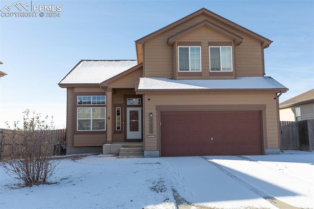 view of front of property featuring a garage