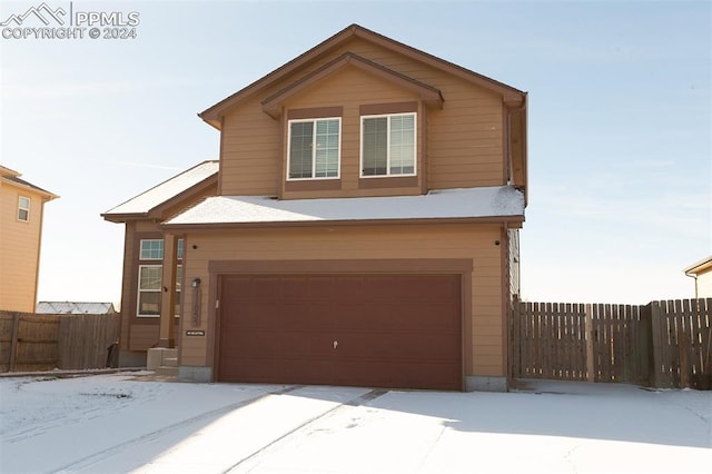 view of front of property with a garage