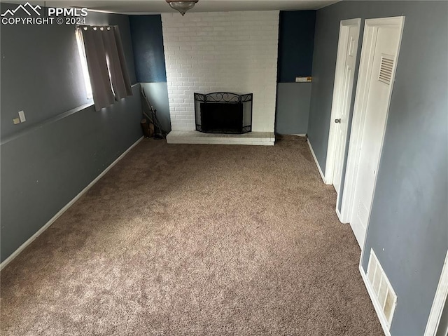 unfurnished living room with a fireplace and carpet floors