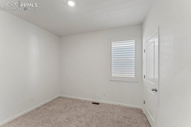 view of carpeted spare room