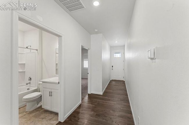 hallway featuring dark hardwood / wood-style floors