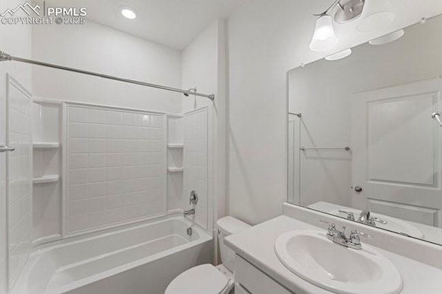 full bathroom featuring toilet, vanity, and tub / shower combination