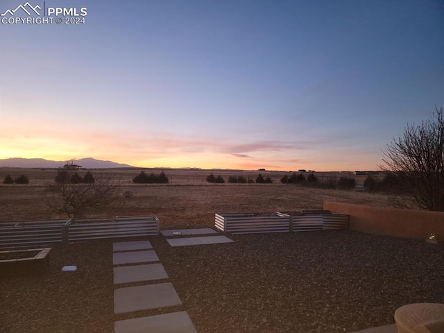 yard at dusk with a mountain view