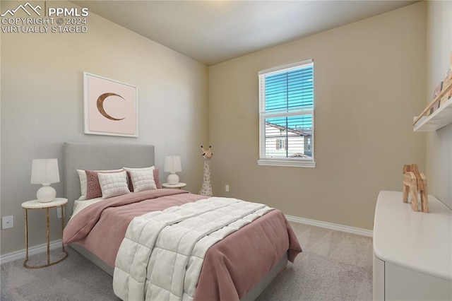 bedroom featuring light carpet