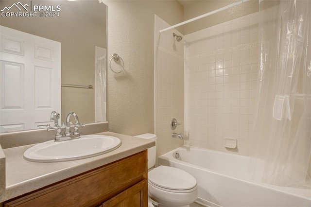 full bathroom featuring vanity, toilet, and shower / tub combo