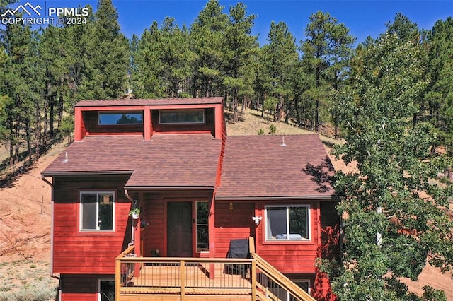 view of front of home featuring a wooden deck