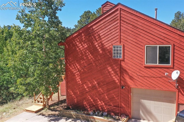 view of property exterior featuring a garage