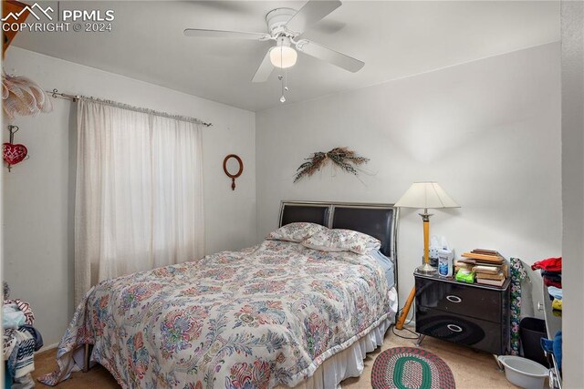 carpeted bedroom featuring ceiling fan