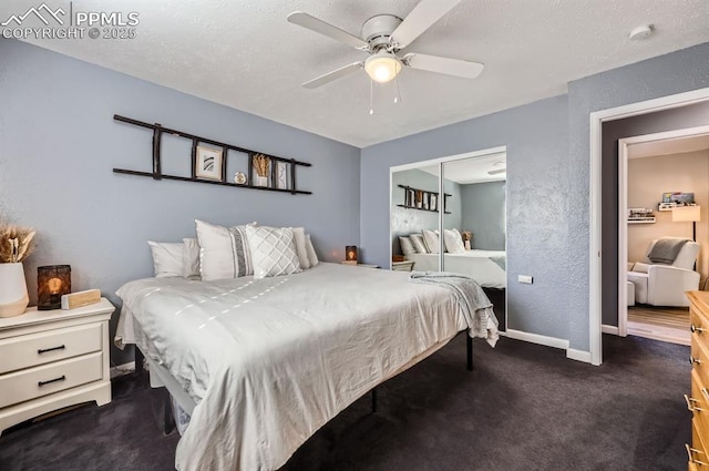 carpeted bedroom featuring a textured ceiling, a closet, and ceiling fan