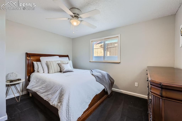 bedroom featuring a textured ceiling and ceiling fan