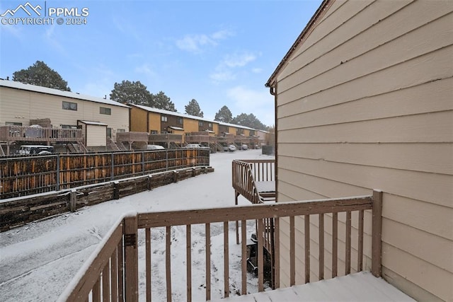 view of snow covered deck