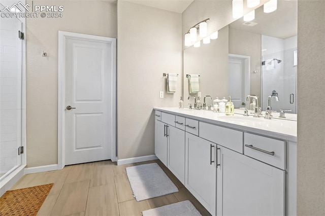 bathroom with vanity and an enclosed shower