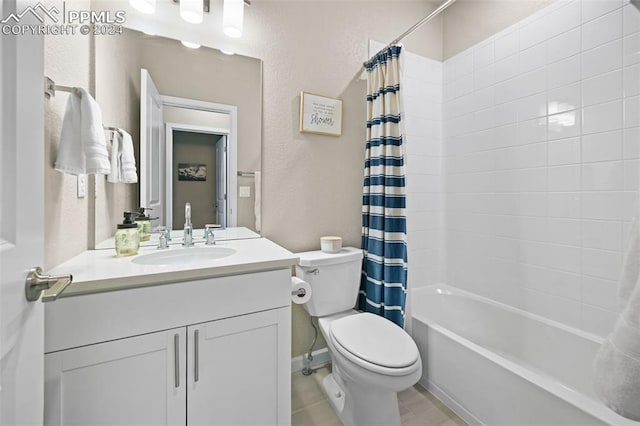 full bathroom with vanity, toilet, and shower / bath combo with shower curtain