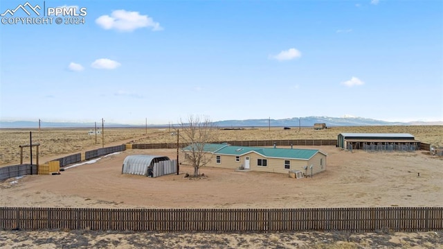 exterior space with a mountain view and a rural view