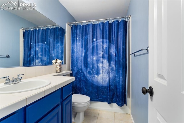 full bathroom with tile patterned flooring, vanity, toilet, and shower / bath combo with shower curtain