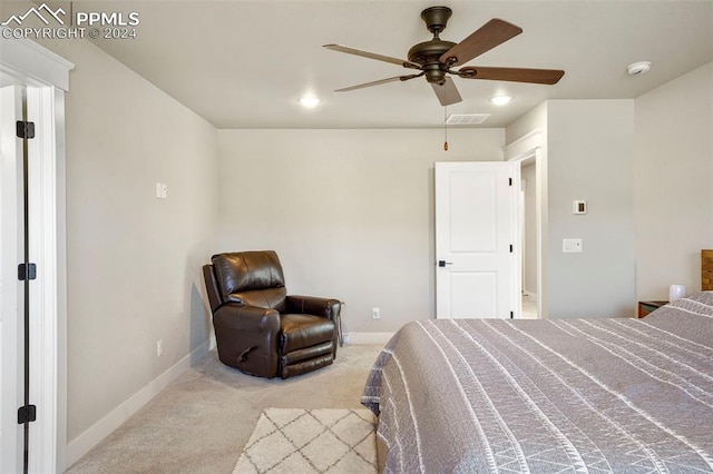 bedroom featuring ceiling fan and light carpet