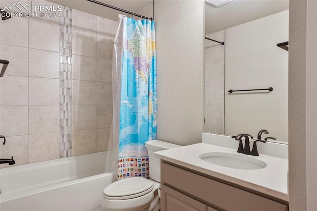 full bathroom featuring shower / tub combo, vanity, and toilet