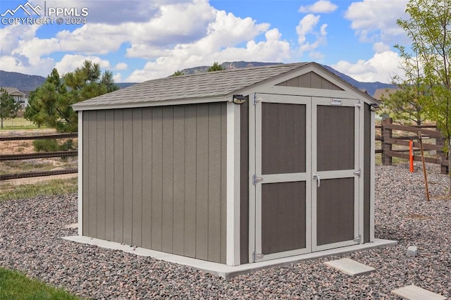 view of outbuilding with a mountain view