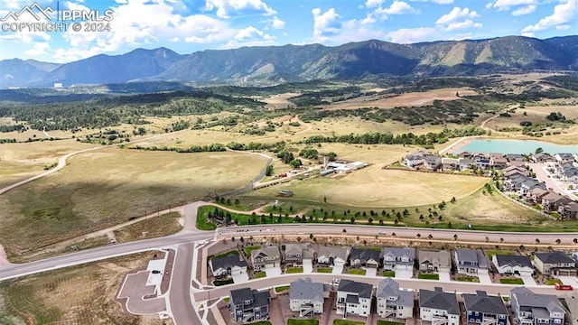 birds eye view of property featuring a mountain view