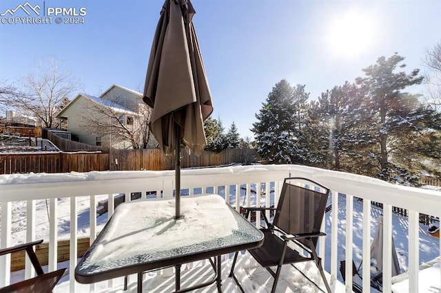 view of snow covered deck