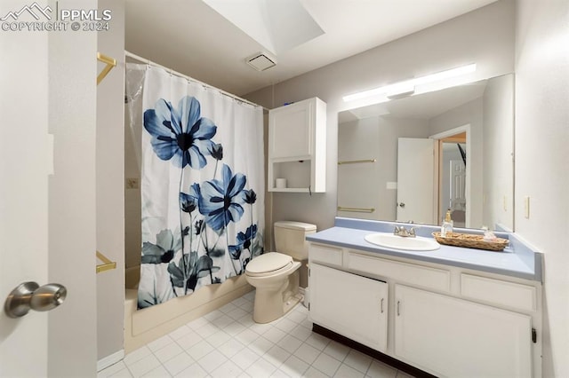 full bathroom featuring toilet, vanity, shower / tub combo with curtain, and tile patterned flooring