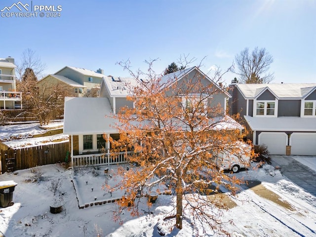 view of front of house featuring a porch and a garage