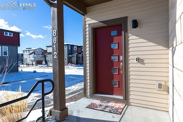 view of snow covered property entrance