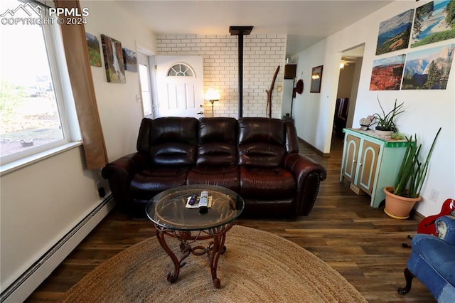 living room with a baseboard radiator and dark hardwood / wood-style floors