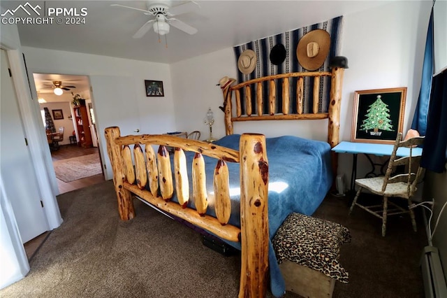 carpeted bedroom with baseboard heating and ceiling fan