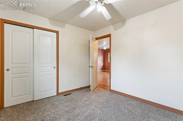 928 Alexander Rd, Colorado Springs, CO 80909 - unfurnished bedroom featuring carpet flooring, a textured ceiling, a closet, and ceiling fan