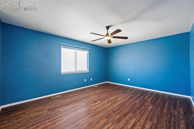 spare room featuring ceiling fan and hardwood / wood-style flooring