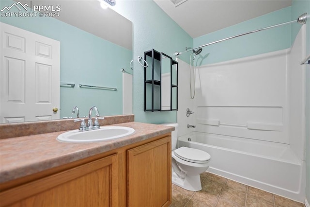 full bathroom featuring tile patterned flooring, vanity, bathing tub / shower combination, and toilet