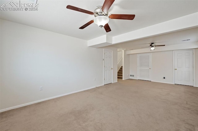 interior space featuring light colored carpet