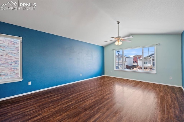 unfurnished room with ceiling fan, lofted ceiling, and hardwood / wood-style flooring