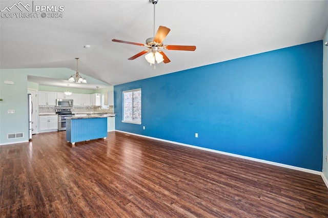 kitchen with white cabinets, stainless steel appliances, vaulted ceiling, and dark wood-type flooring