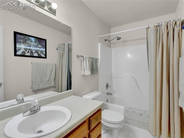 full bathroom with shower / bath combo, vanity, and toilet