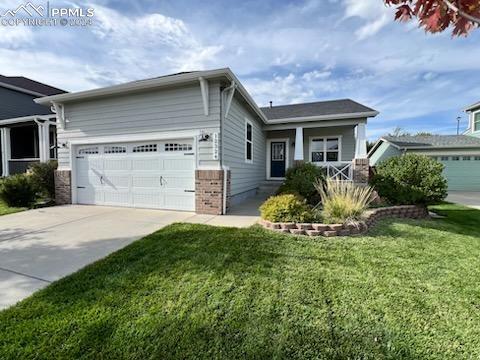 view of front of house with a front lawn and a garage