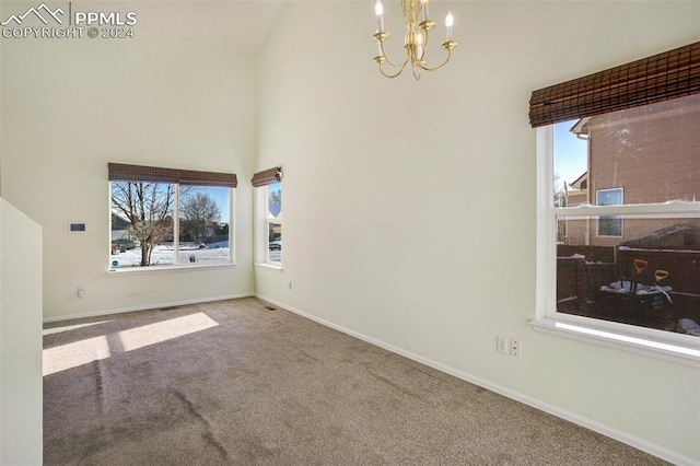 living room featuring carpet, high vaulted ceiling, and a chandelier