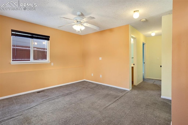 unfurnished room with ceiling fan, carpet floors, and a textured ceiling