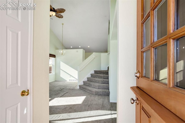 staircase with carpet and an inviting chandelier