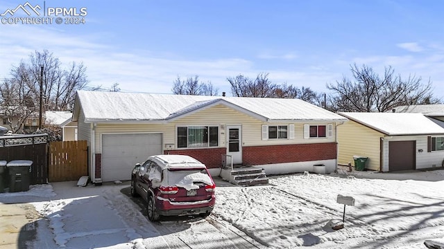 ranch-style house featuring a garage