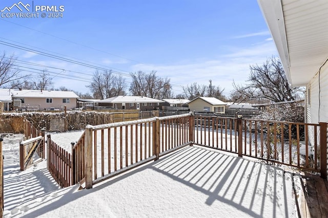 view of snow covered deck