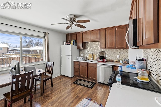 kitchen with tasteful backsplash, stainless steel dishwasher, ceiling fan, sink, and white fridge