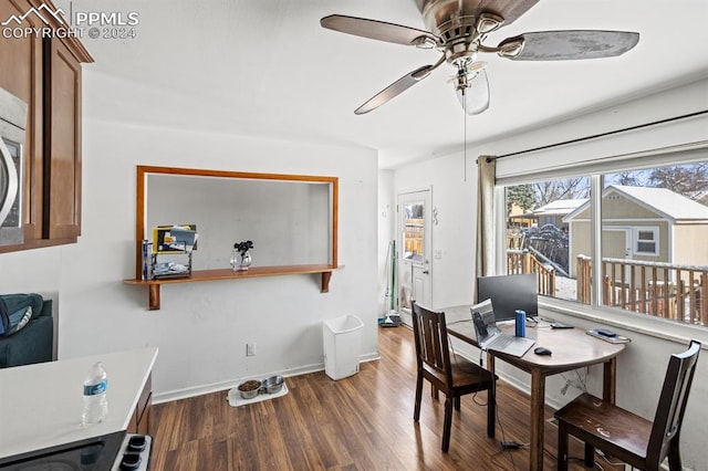 home office with ceiling fan and dark wood-type flooring