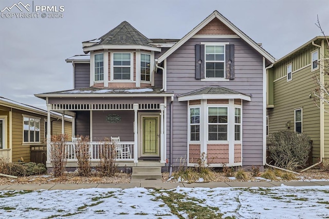 victorian house featuring covered porch