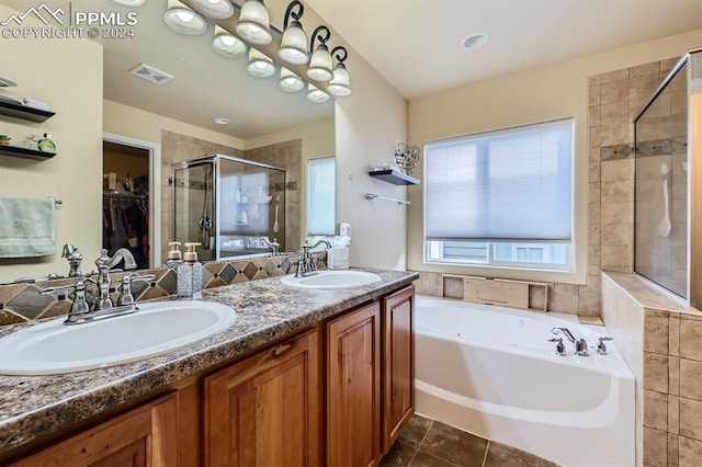 bathroom featuring vanity, tile patterned flooring, and independent shower and bath