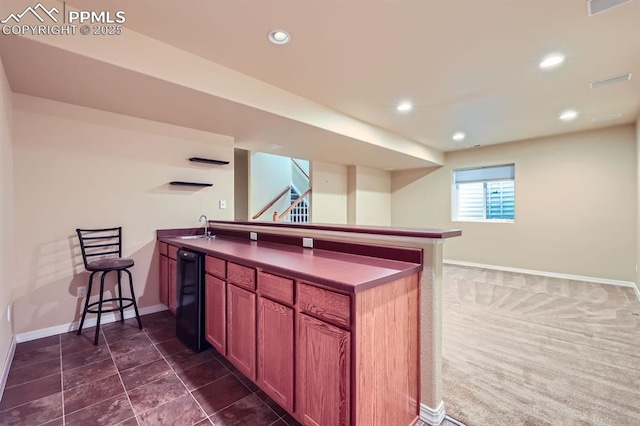 kitchen featuring sink and kitchen peninsula