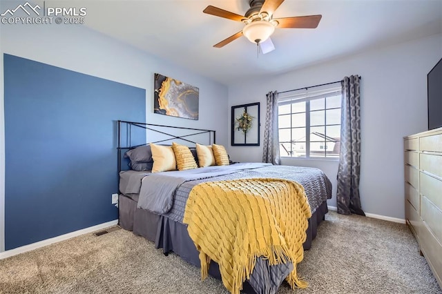 bedroom with ceiling fan and carpet flooring